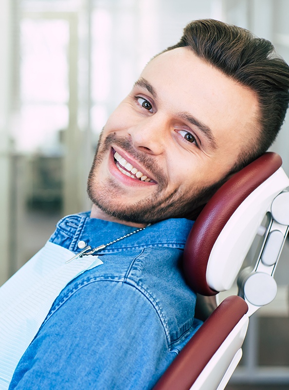 Smiling man in dental chair