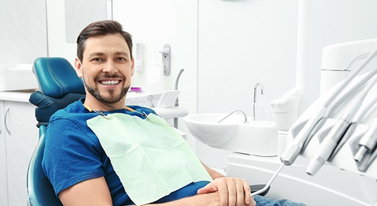 Smiling man in dental chair