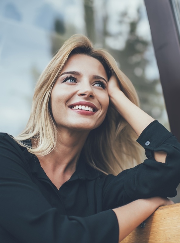 Woman with gorgeous smile after cosmetic dentistry