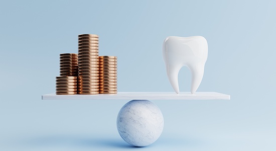 Stacks of golden coins and a model tooth on a balance beam