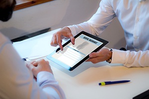 A dental insurance agent discussing dental insurance with a patient