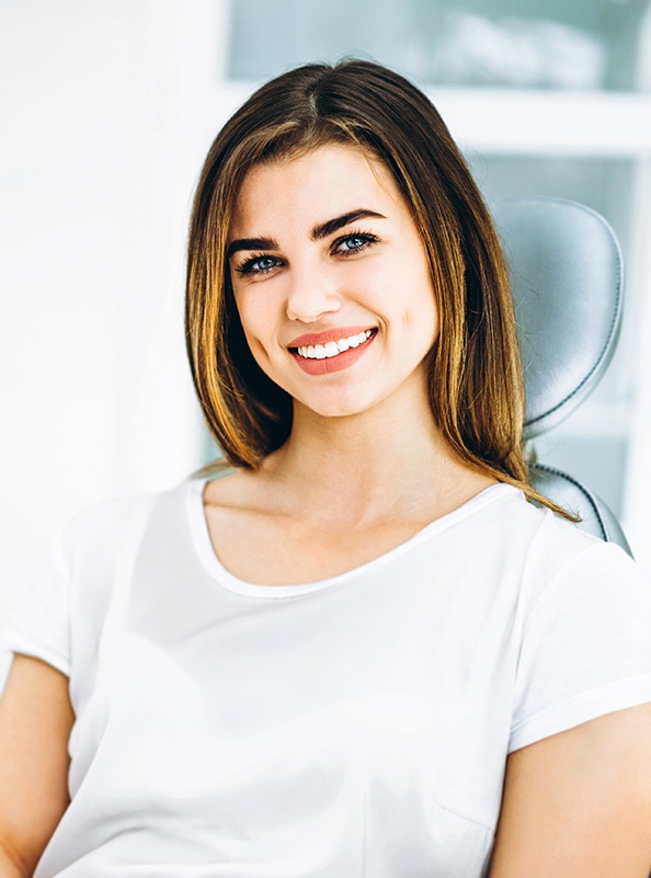 Woman in dental chair smiling