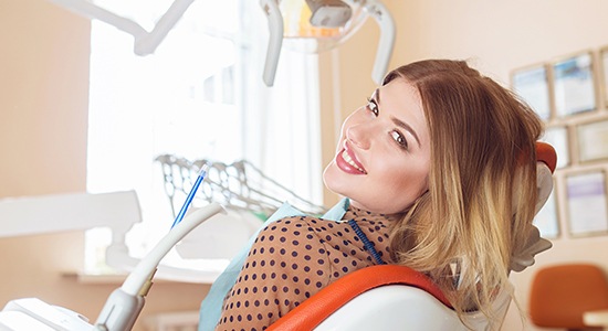 Smiling woman in dental chair