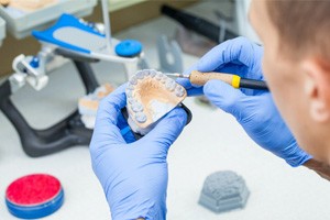 technician carving dentures