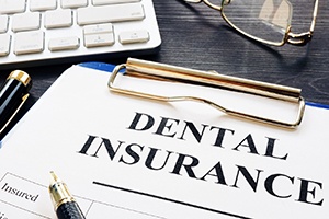 dental insurance form near a keyboard