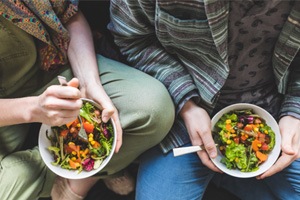 Couple eating well-balanced salad together