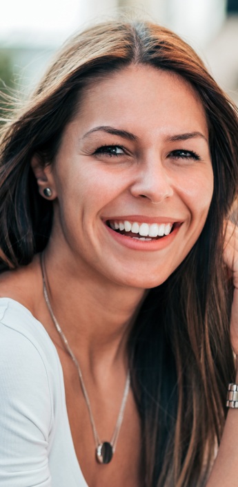 Woman with beautiful smile after cosmetic dentistry