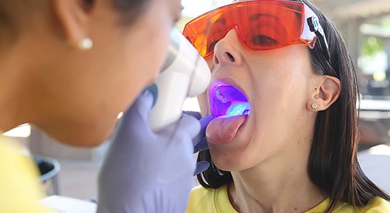 Patient receiving oral cancer screening