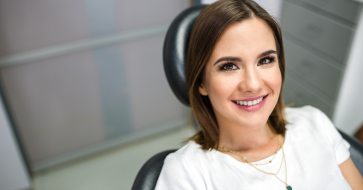 Woman smiling during dental office visit