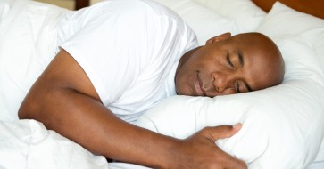 Man sleeping soundly thanks to sleep apnea therapy