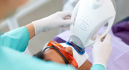 Patient receiving Zoom in office teeth whitening treatment