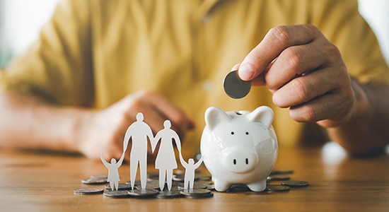 Patient in Powell saving for teeth whitening with piggy bank