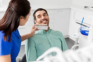 Dentist in Powell reviewing teeth whitening results with a patient