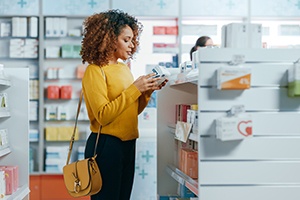 Patient browsing pharmacy for teeth whitening products