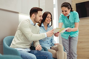 Patient in Powell discussing teeth whitening financing options with dental team